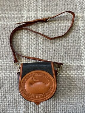 Dooney & Bourke All Weather duck small pebbles leather cross body bag